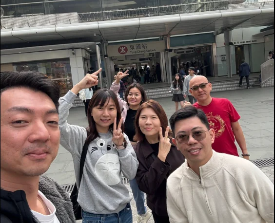 Katherine Leow with a group outside a station